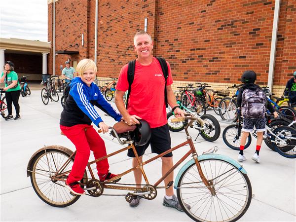 Students bike to school in the morning.
